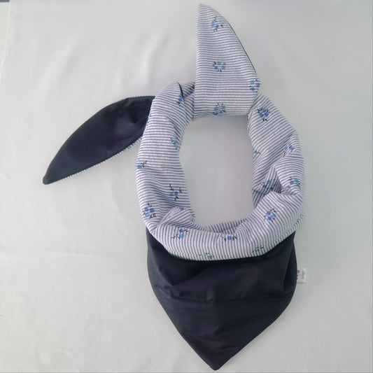 Reversible quilted shawl with a dark floral cotton print and water-resistant black lining, perfect for elegant layering and cool weather style.